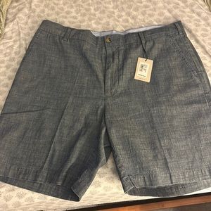 Brand new Peter Millar shorts with an indigo color